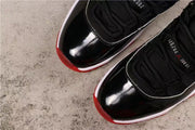 Air Jordan 11 Retro Bred Black and Red High-Top Sneakers