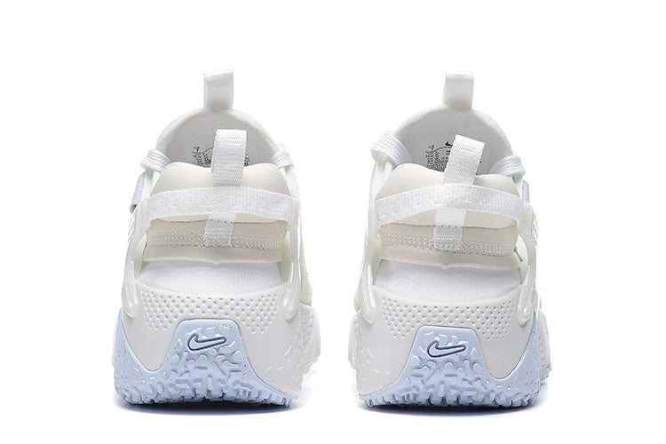 Nike Air Huarache Run Sneakers in White and Pale Blue