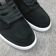 Air Jordan 1 Mid Black, White & Red Sneakers 554724-060